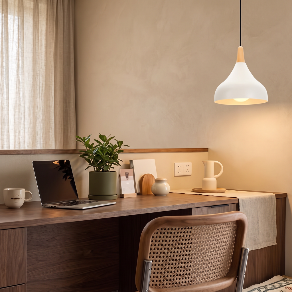 White teardrop pendant light above a walnut home office desk against a warm beige wall