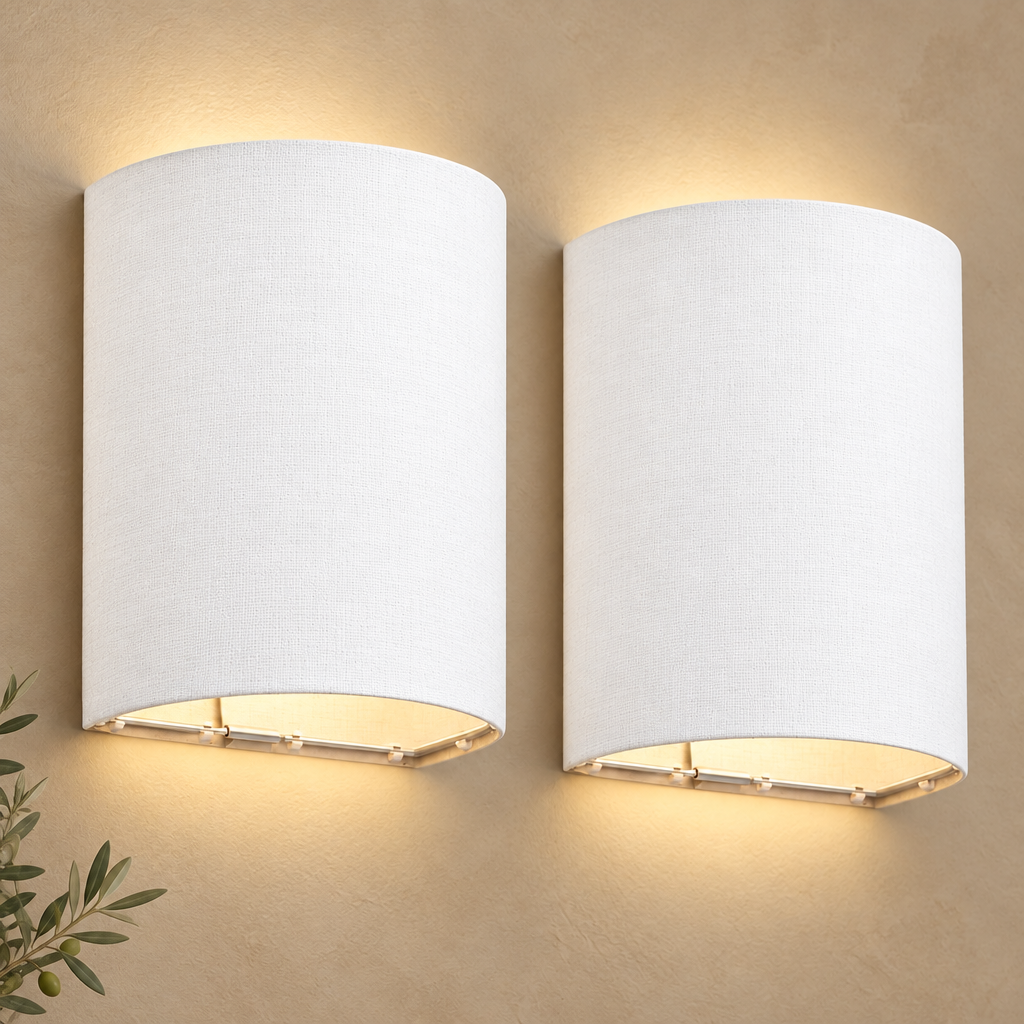 Close-up of two white fabric-shade rechargeable wall lights on a warm beige wall