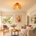 Woven bamboo dome ceiling light glowing in a calm living room